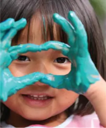 Girl with paint on her hands